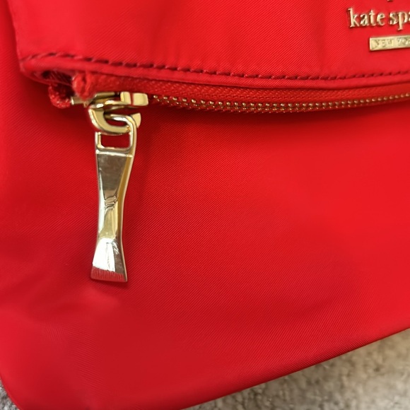 Kate Spade Red cross body purse. Fold over flap style. Zip pocket on front. - Picture 4 of 14